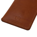 Brown leather wallet with Saltwater Leather branding on a white background