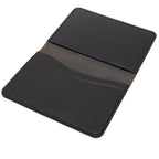 Black passport holder on a white background