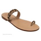 Tan sandal with a leopard print strap on a white background