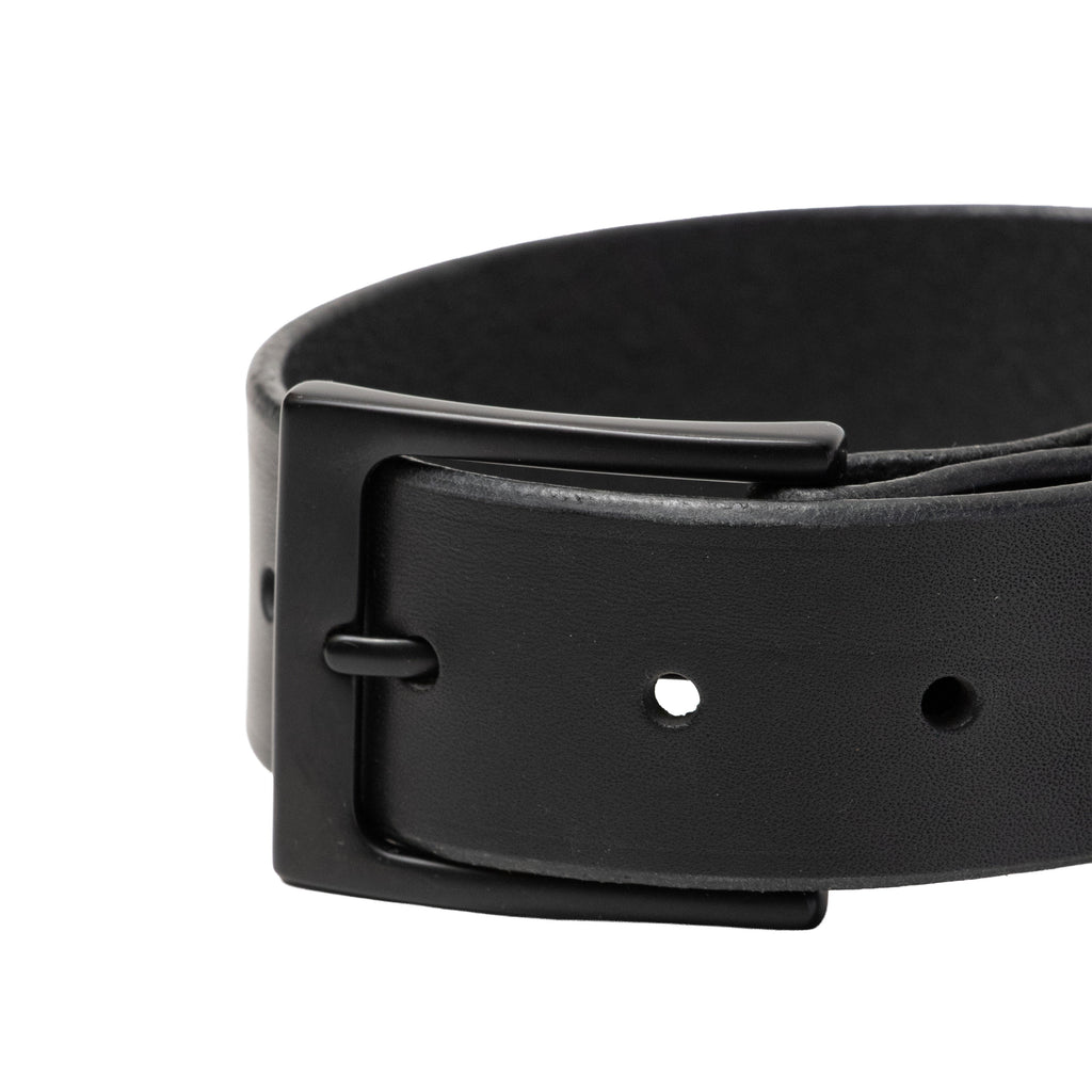 Black leather belt with a buckle on a white background
