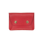 Red leather wallet with brass buttons on a white background
