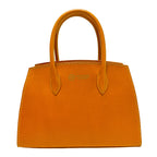 Orange handbag with visible stitching on a white background