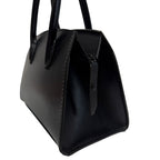 Black handbag with a zipper on a white background