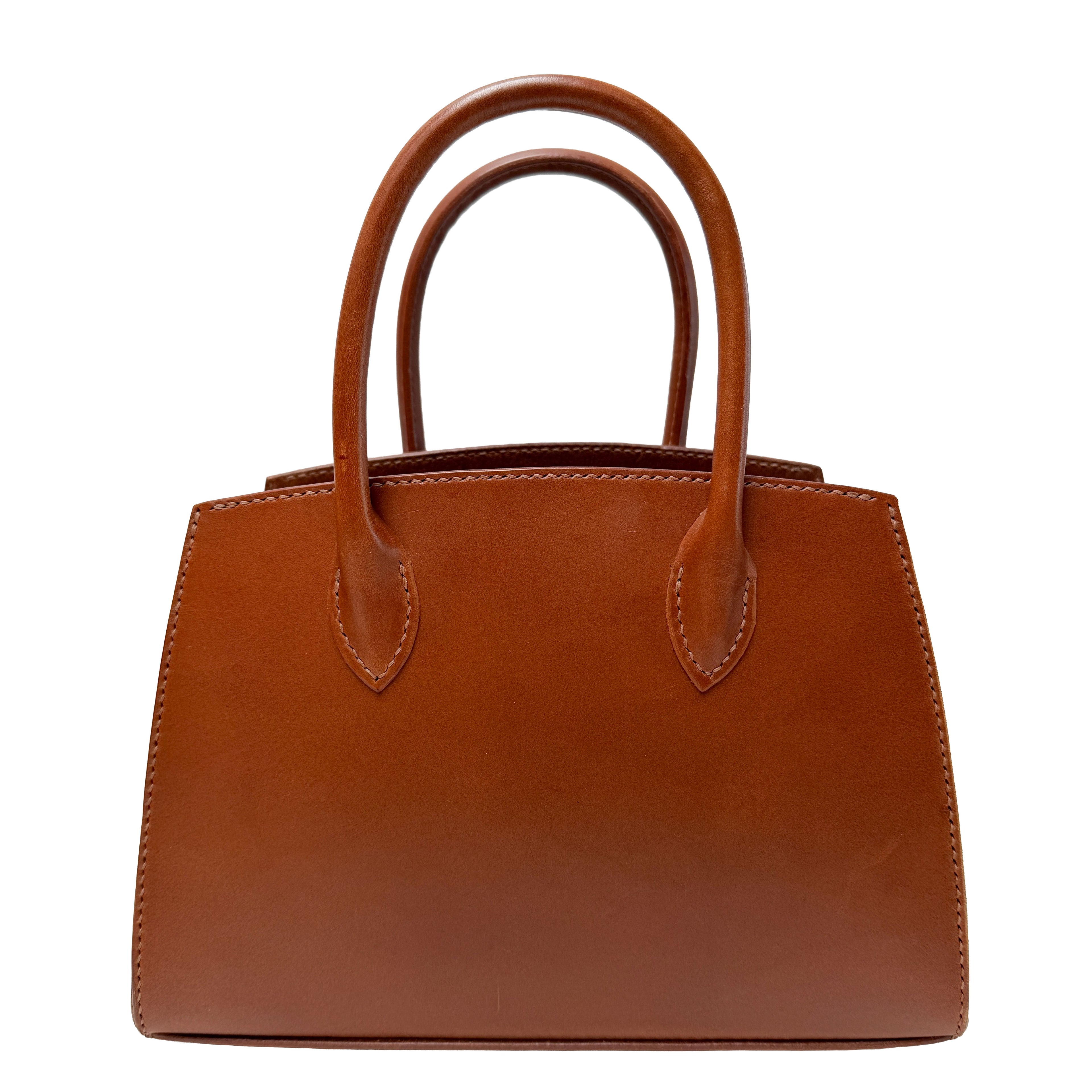 Brown leather handbag on a white background