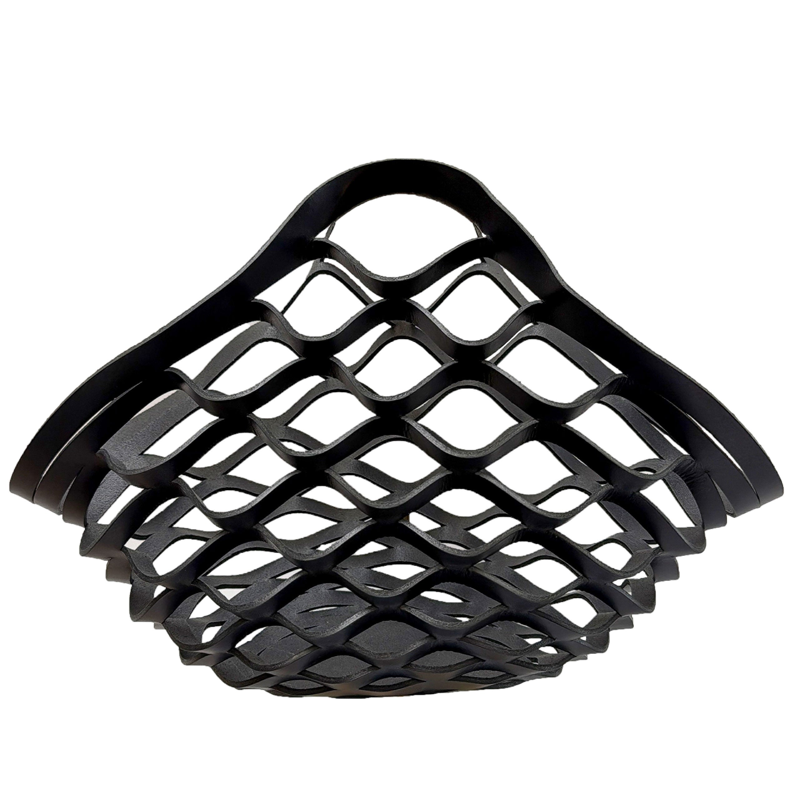 Black leather woven basket on a white background