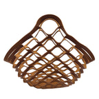Brown leather woven basket with a handle on a white background