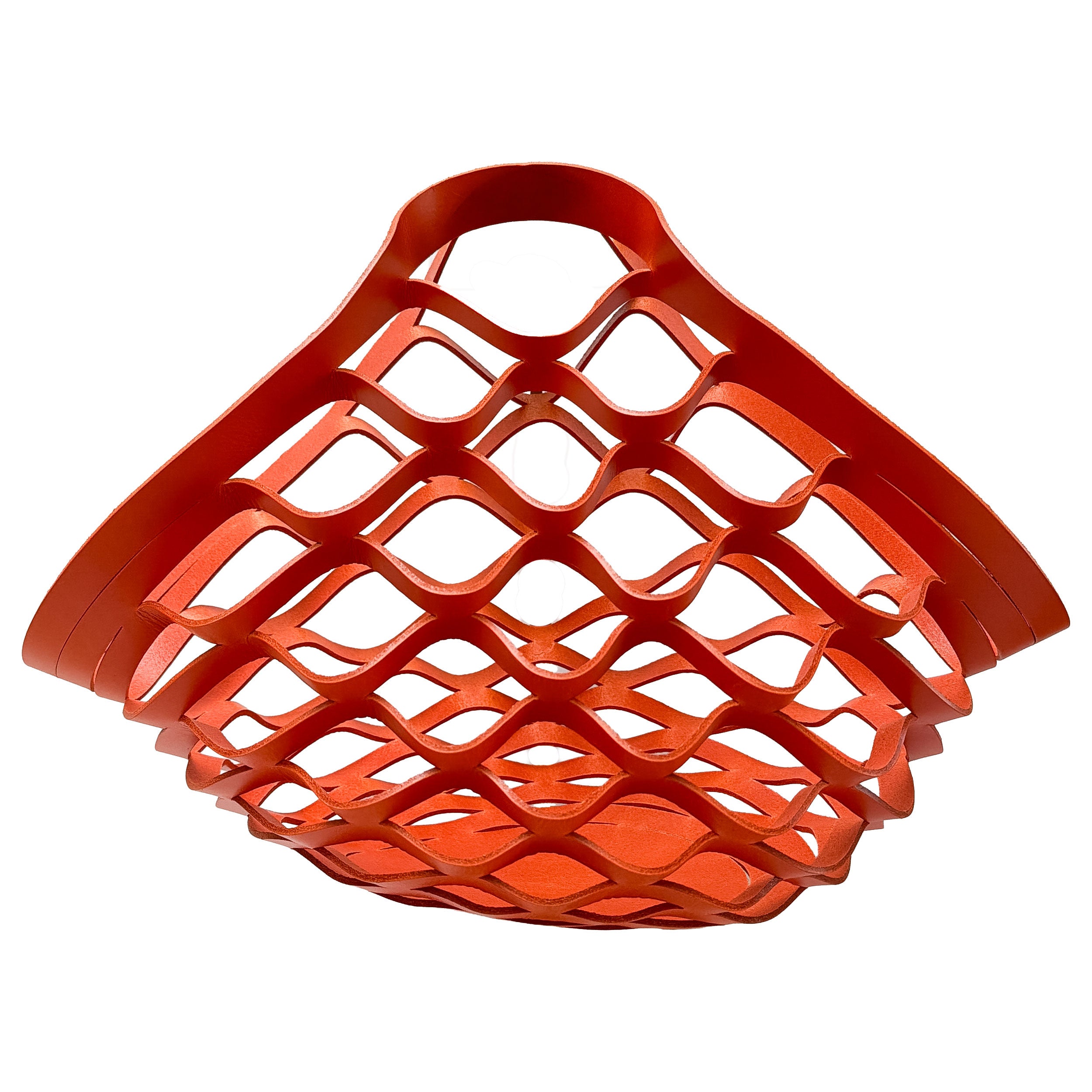 Red woven leather basket on a white background