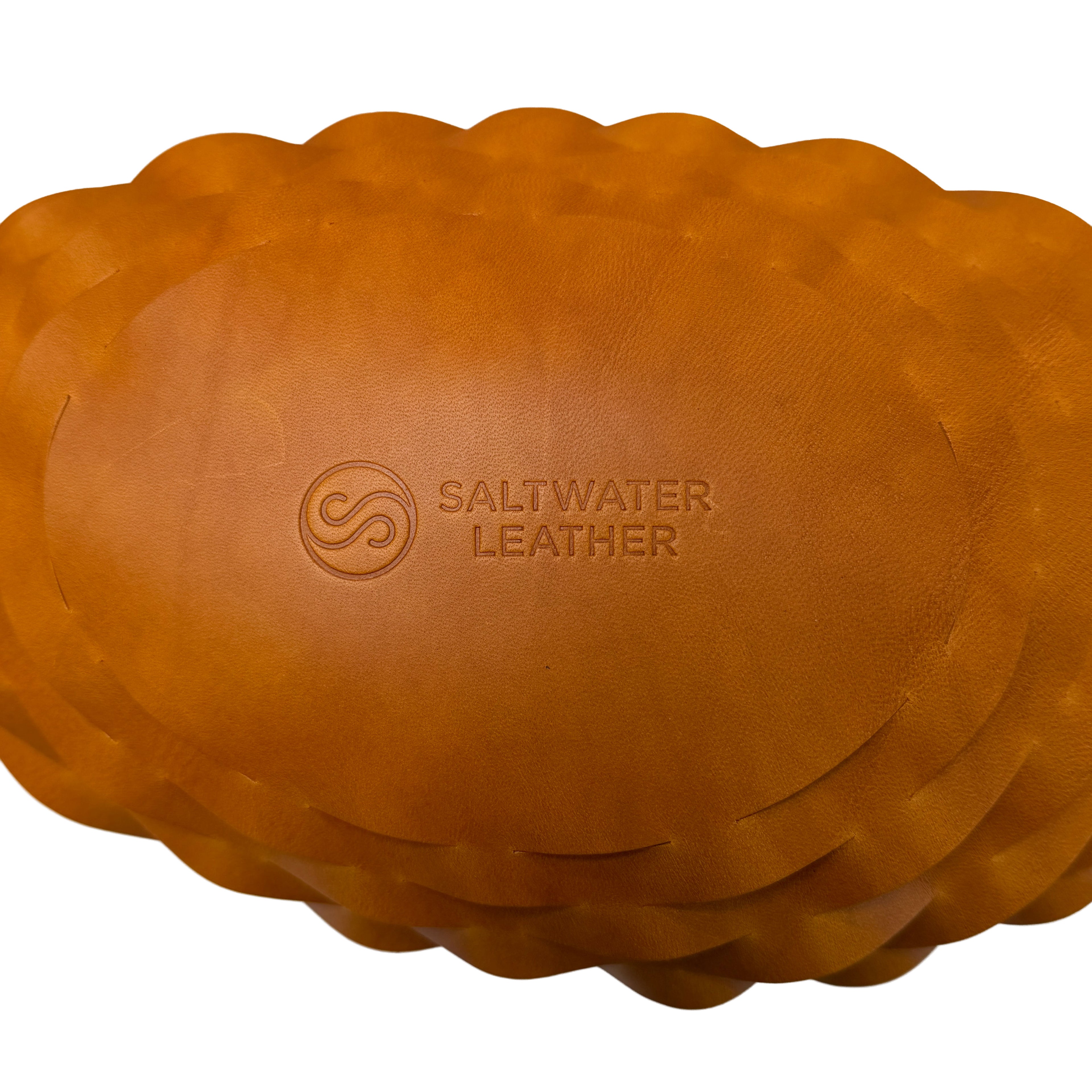 Brown leather woven bag with Saltwater Leather branding on a white background