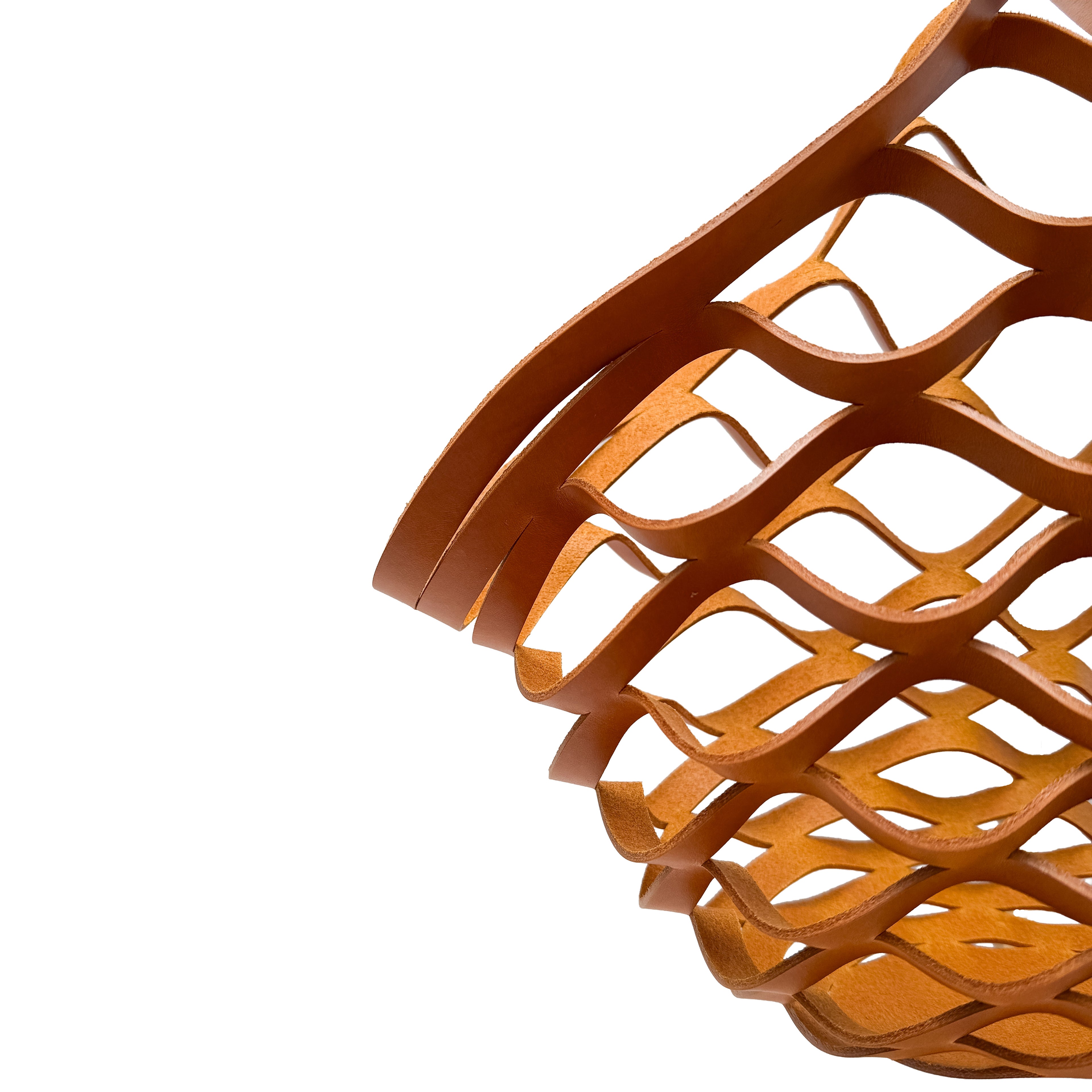 Close-up of a yellow leather woven basket on a white background