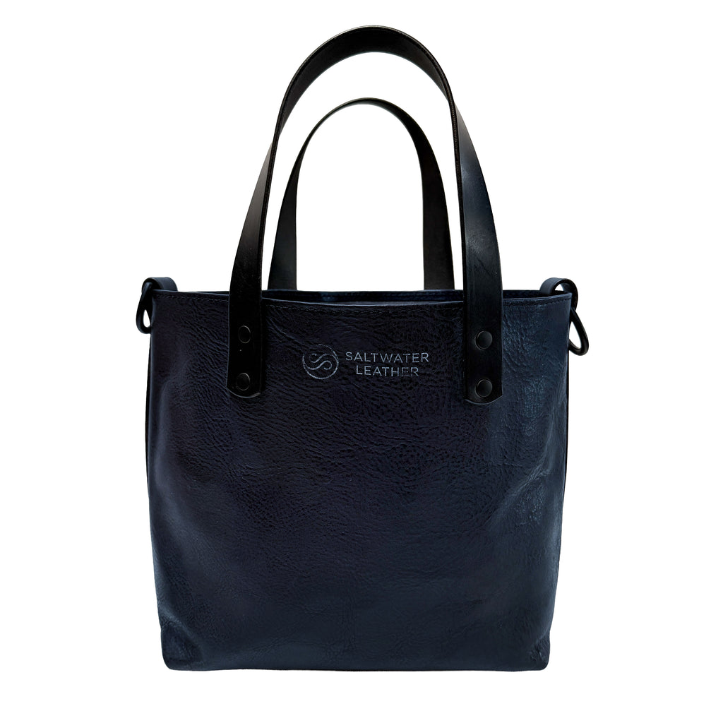 Black leather tote bag with Saltwater Leather logo on a white background