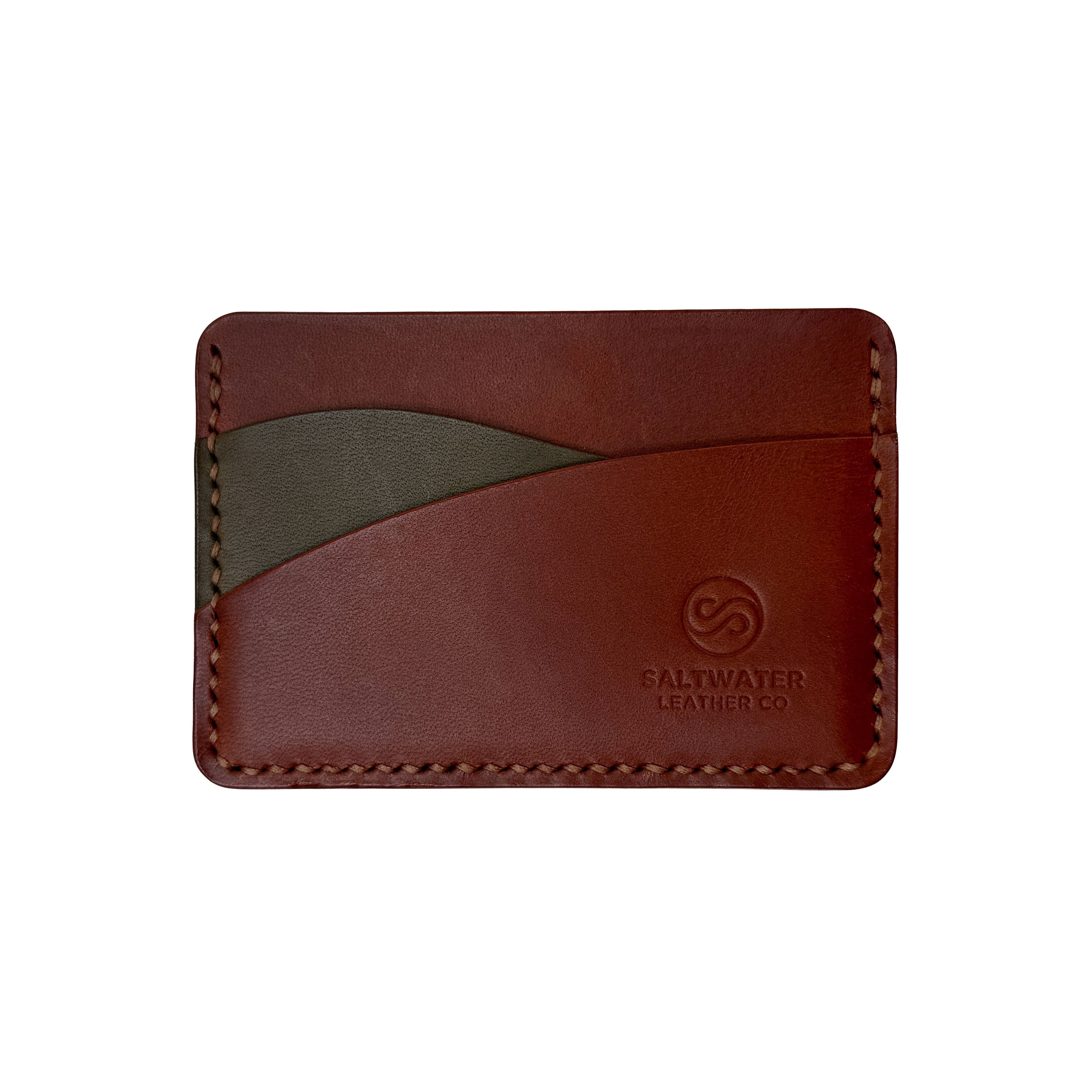 Brown leather cardholder with visible brand logo on a white background
