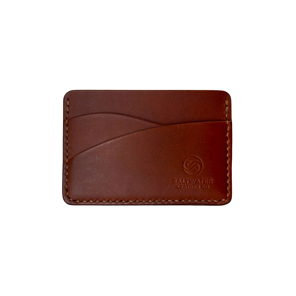Brown leather cardholder with visible brand logo on a white background