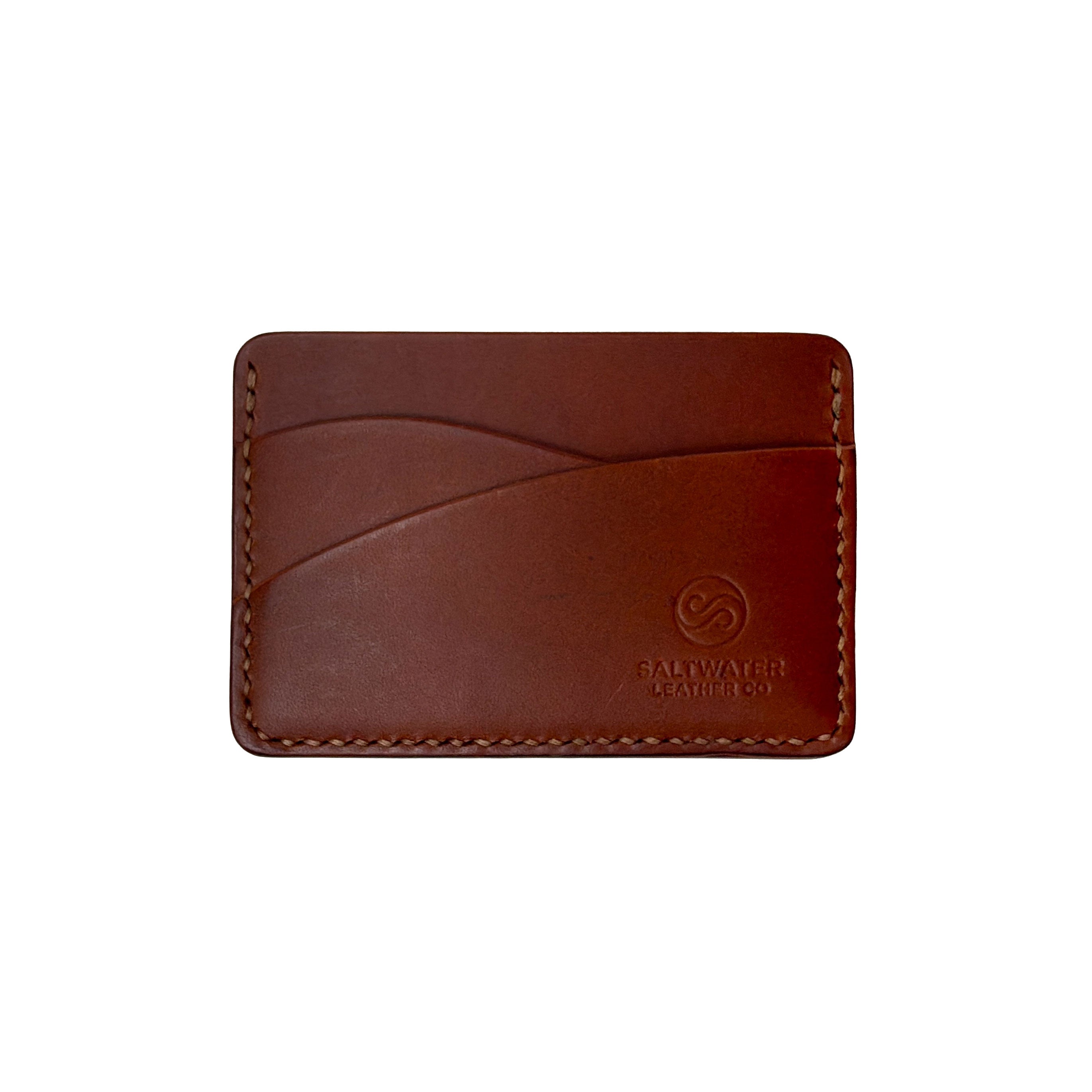 Brown leather cardholder with visible brand logo on a white background