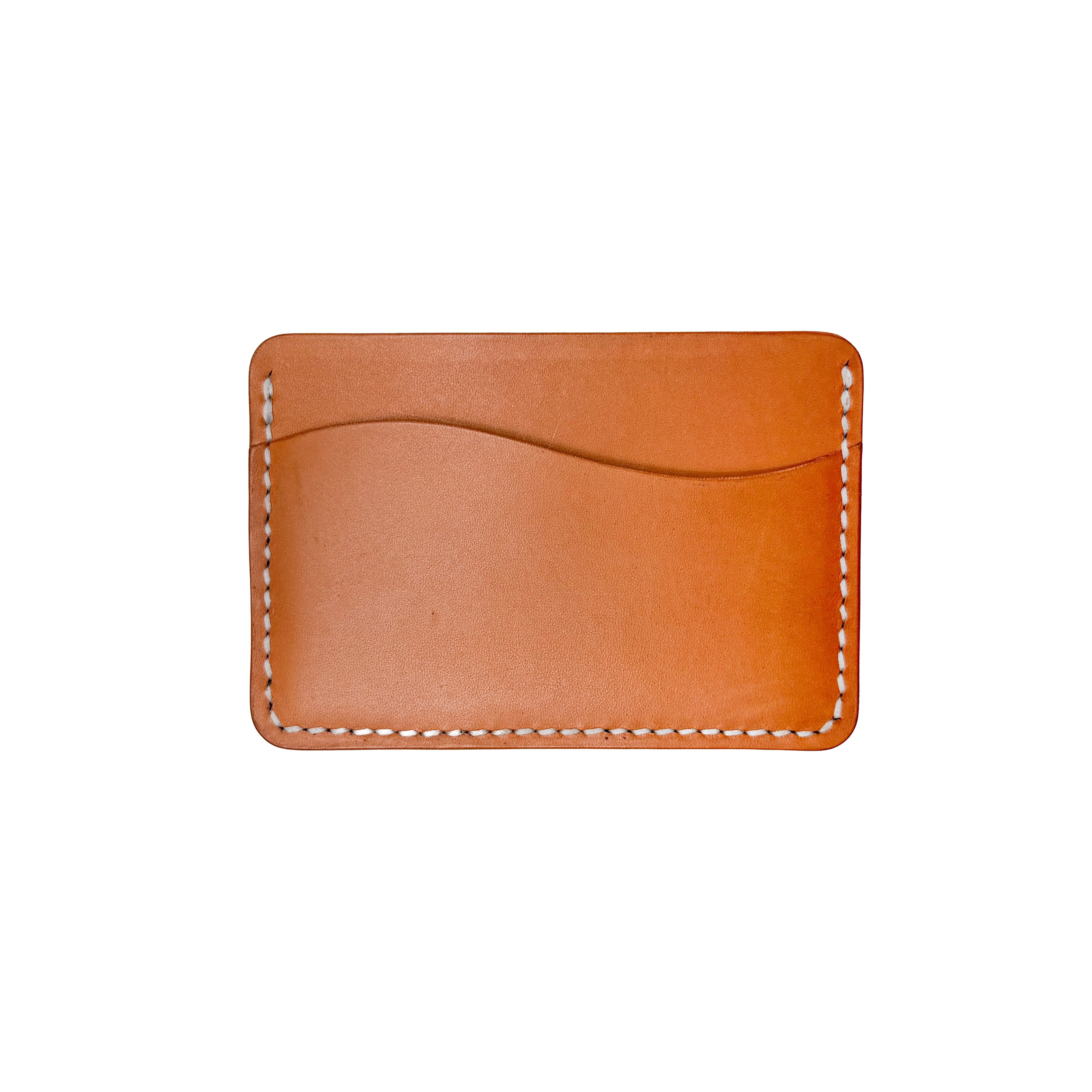 Brown leather cardholder with white stitching on a white background