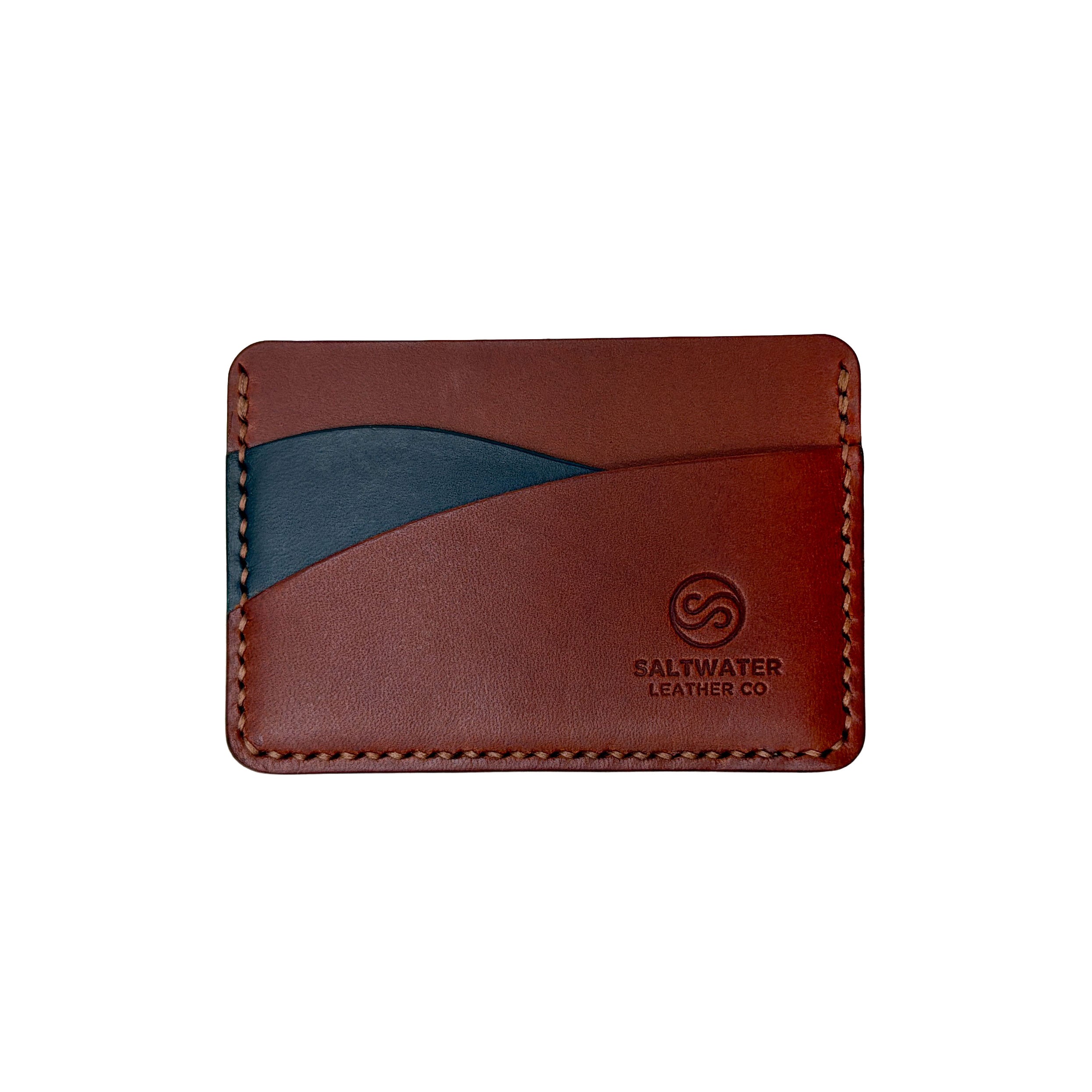 Brown leather cardholder with a blue accent on a white background, featuring the Saltwater Leather logo.