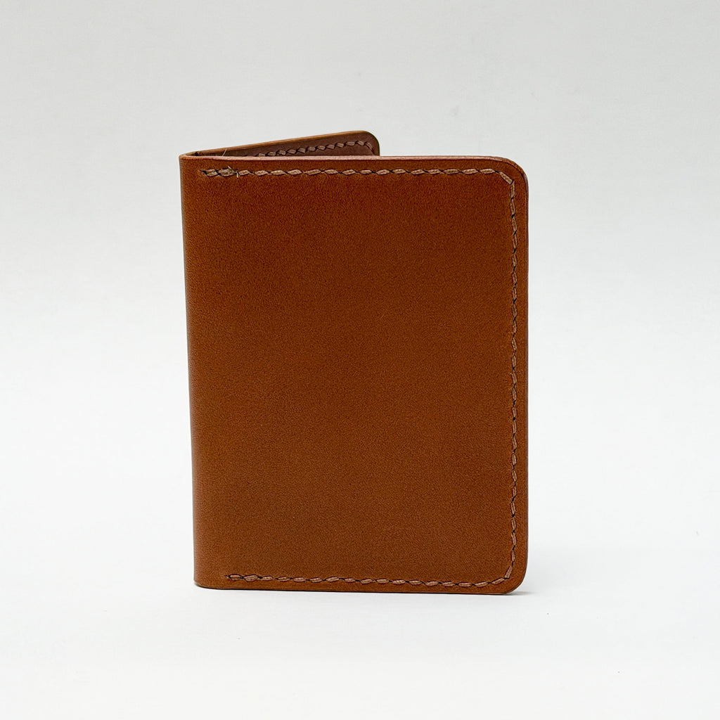 Brown leather wallet on a white background