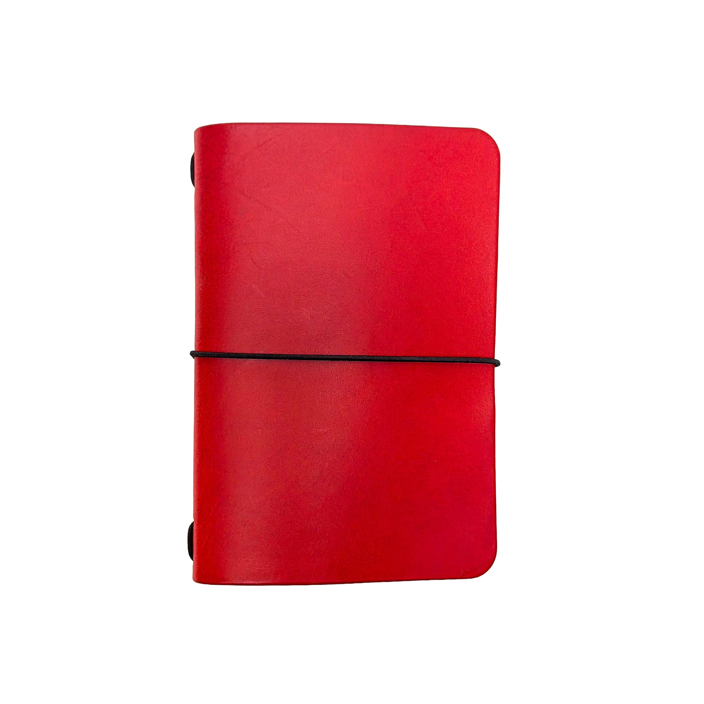 Saltwater Leather vegetable tanned leather journal cover in Cherry red with an elastic band closure, photographed against a white background.