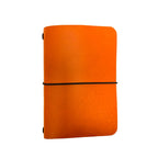 Saltwater Leather vegetable tanned leather journal cover in California Poppy orange with an elastic band closure, photographed against a white background.