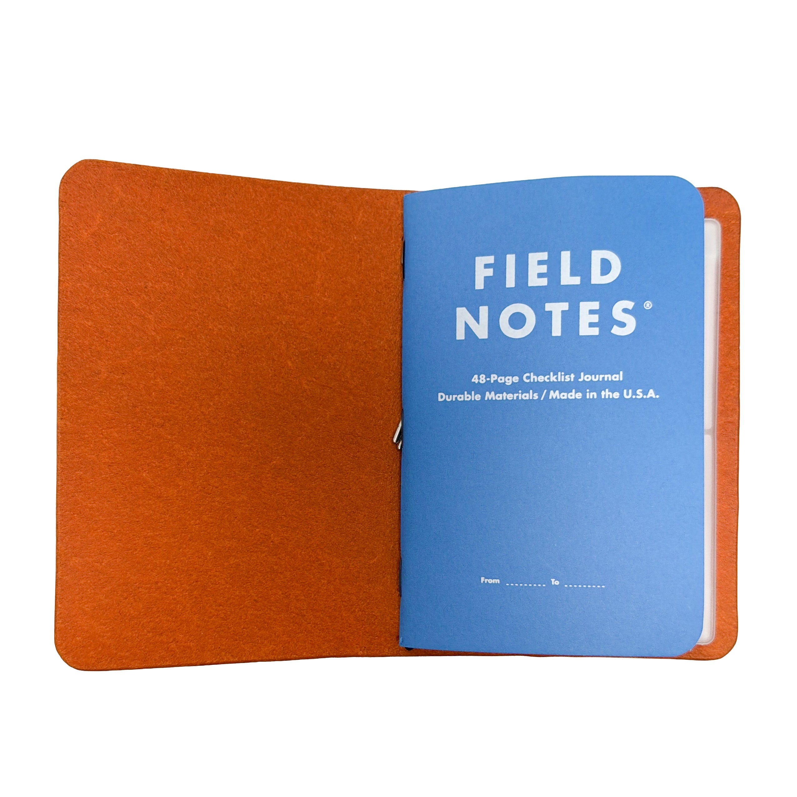 Interior of a Saltwater Leather journal cover in California Poppy holding a Field Notes memo book, open against a white background.