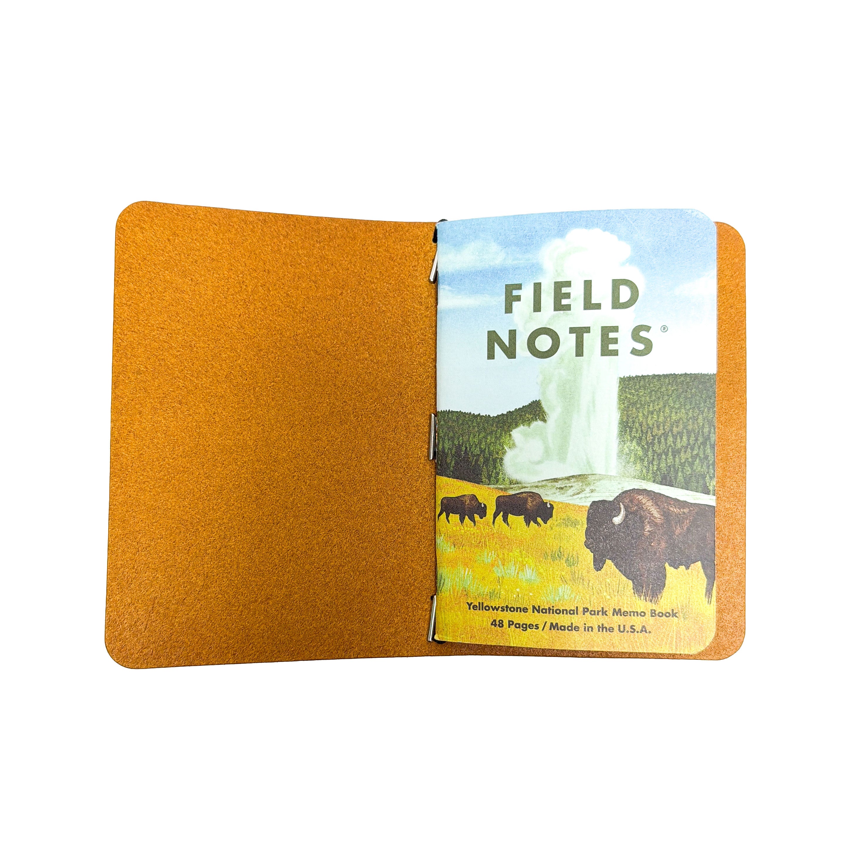 Interior of a Saltwater Leather journal cover in Mustard yellow holding a Field Notes memo book, open against a white background.