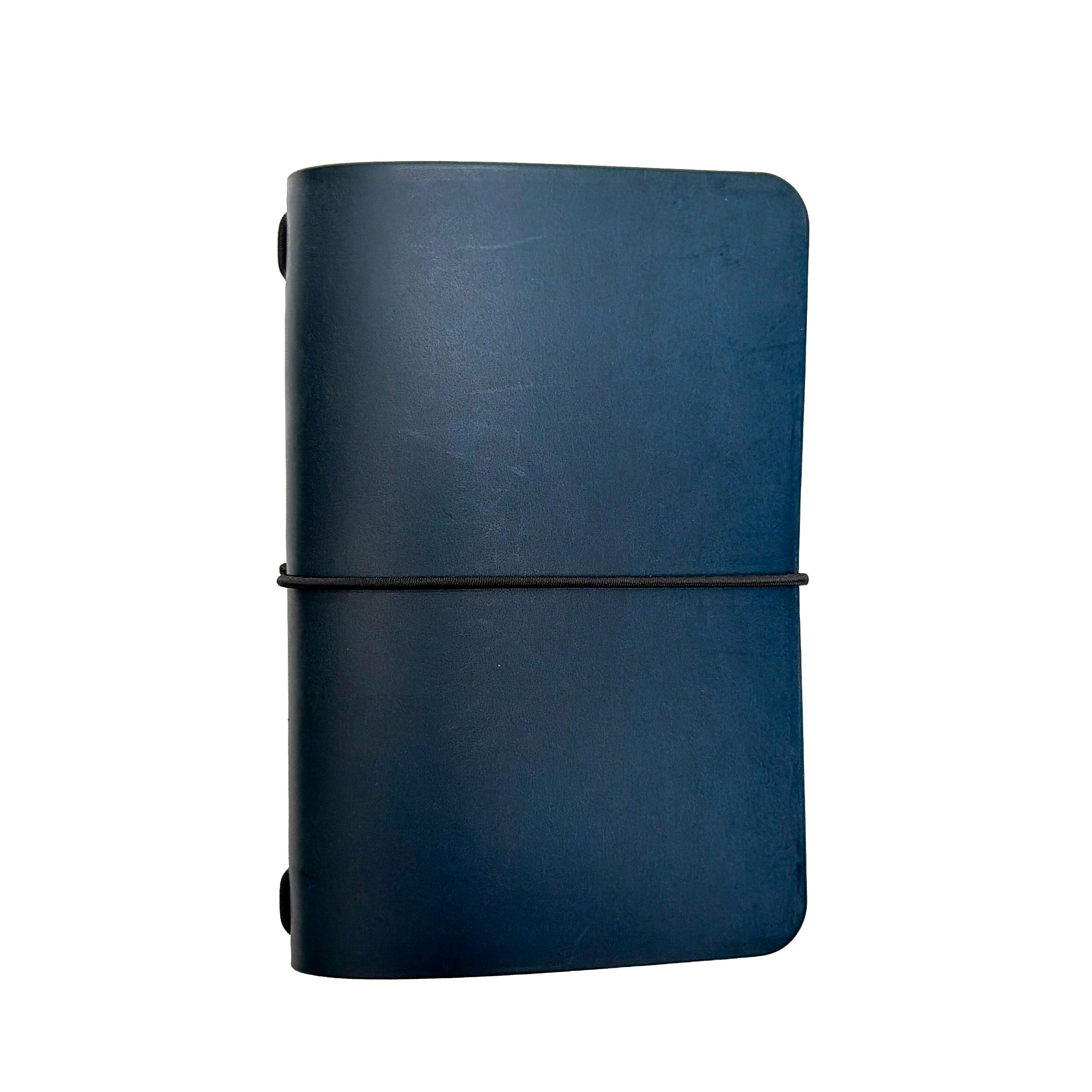 Saltwater Leather vegetable tanned leather journal cover in Pacific blue with an elastic band closure, photographed against a white background.