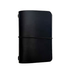 Saltwater Leather vegetable tanned leather journal cover in Midnight black with an elastic band closure, photographed against a white background.