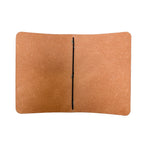 Interior of a Saltwater Leather natural color journal cover open against a white background.