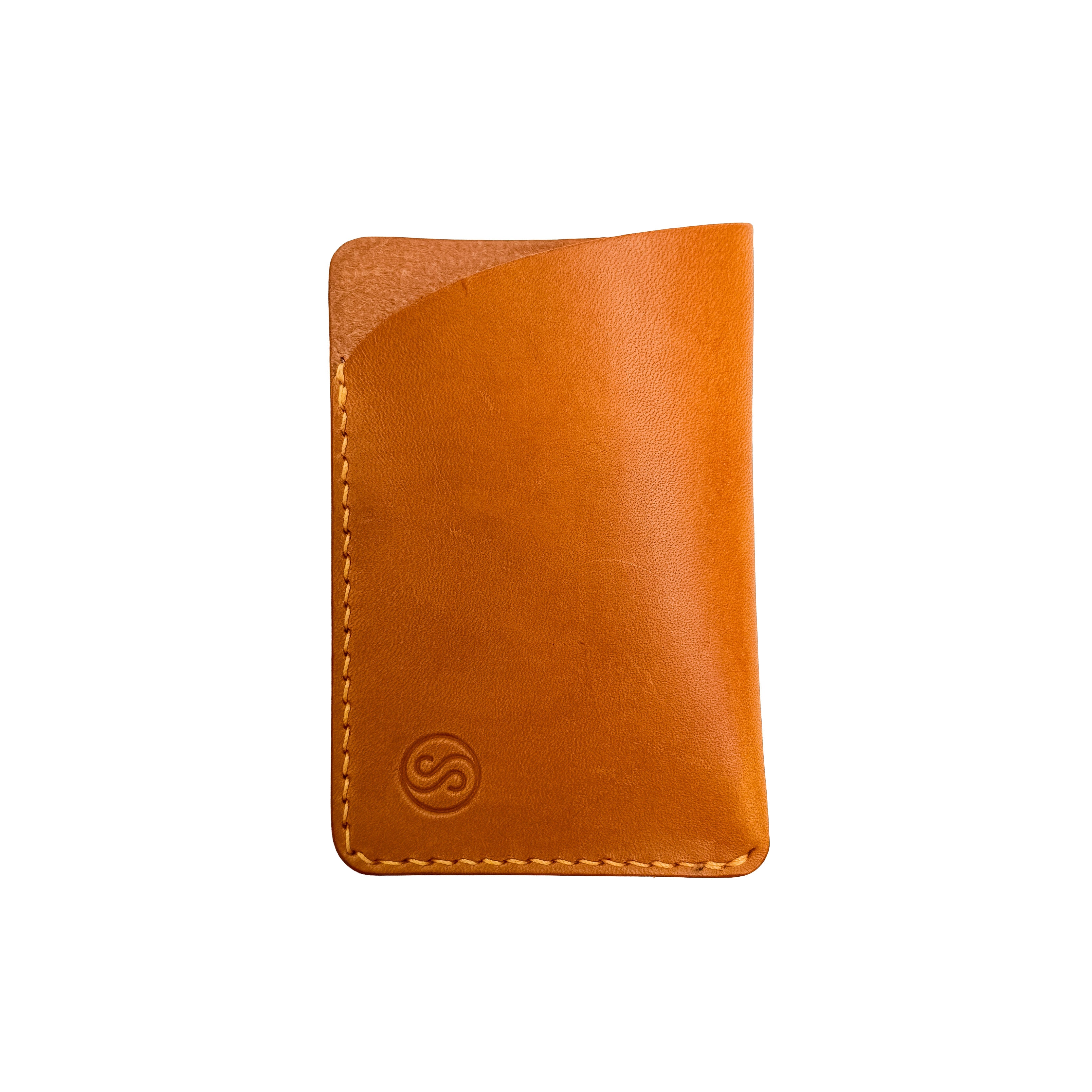 Yellow leather wallet on a white background