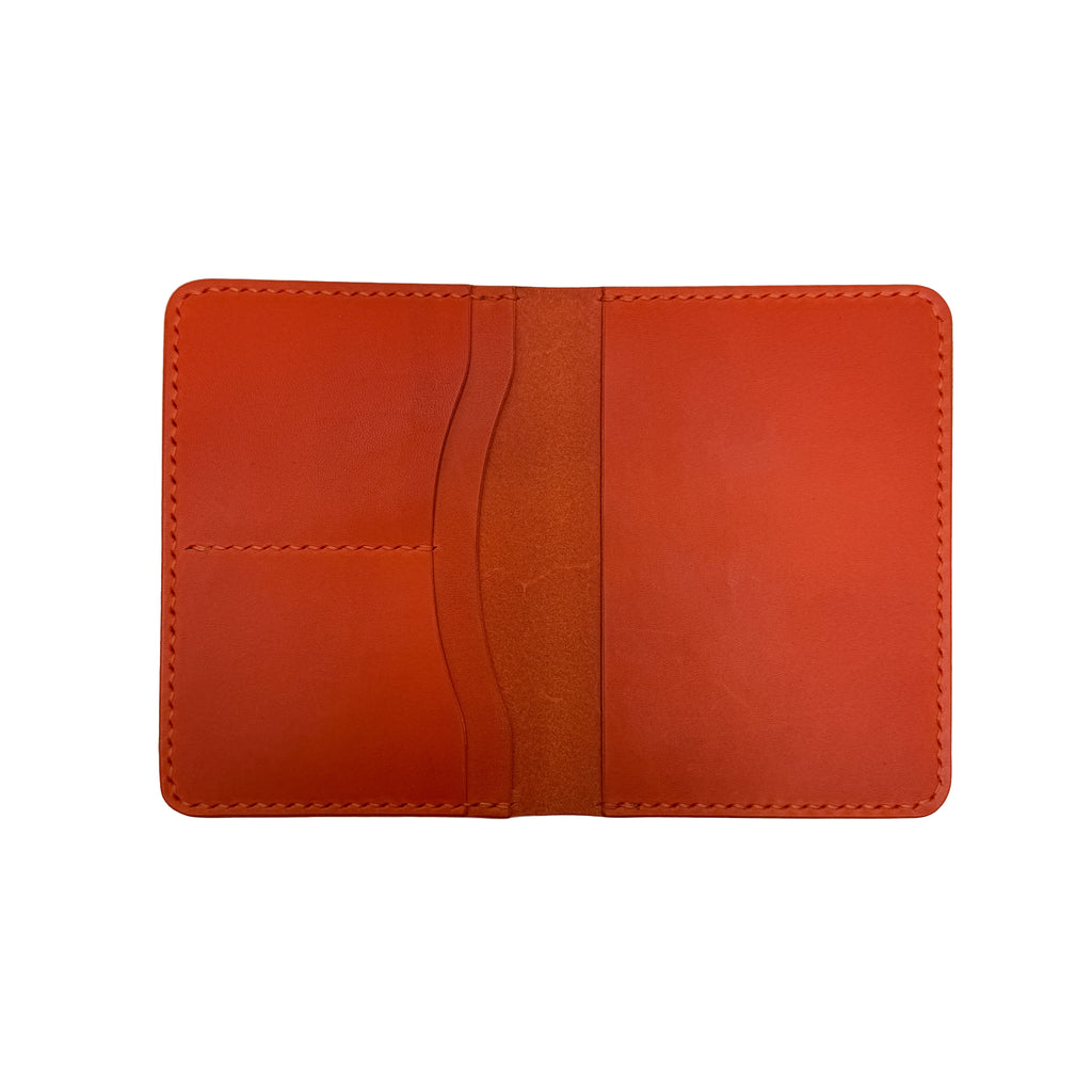 Orange passport holder on a white background