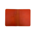 Orange passport holder on a white background