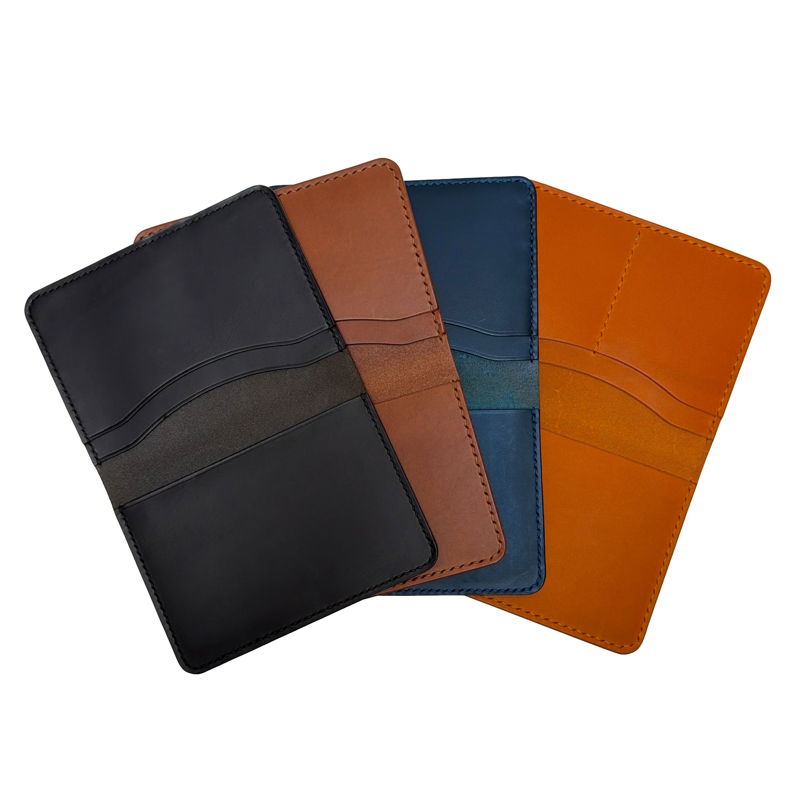 Four leather passport holders in black, brown, orange, and blue on a white background