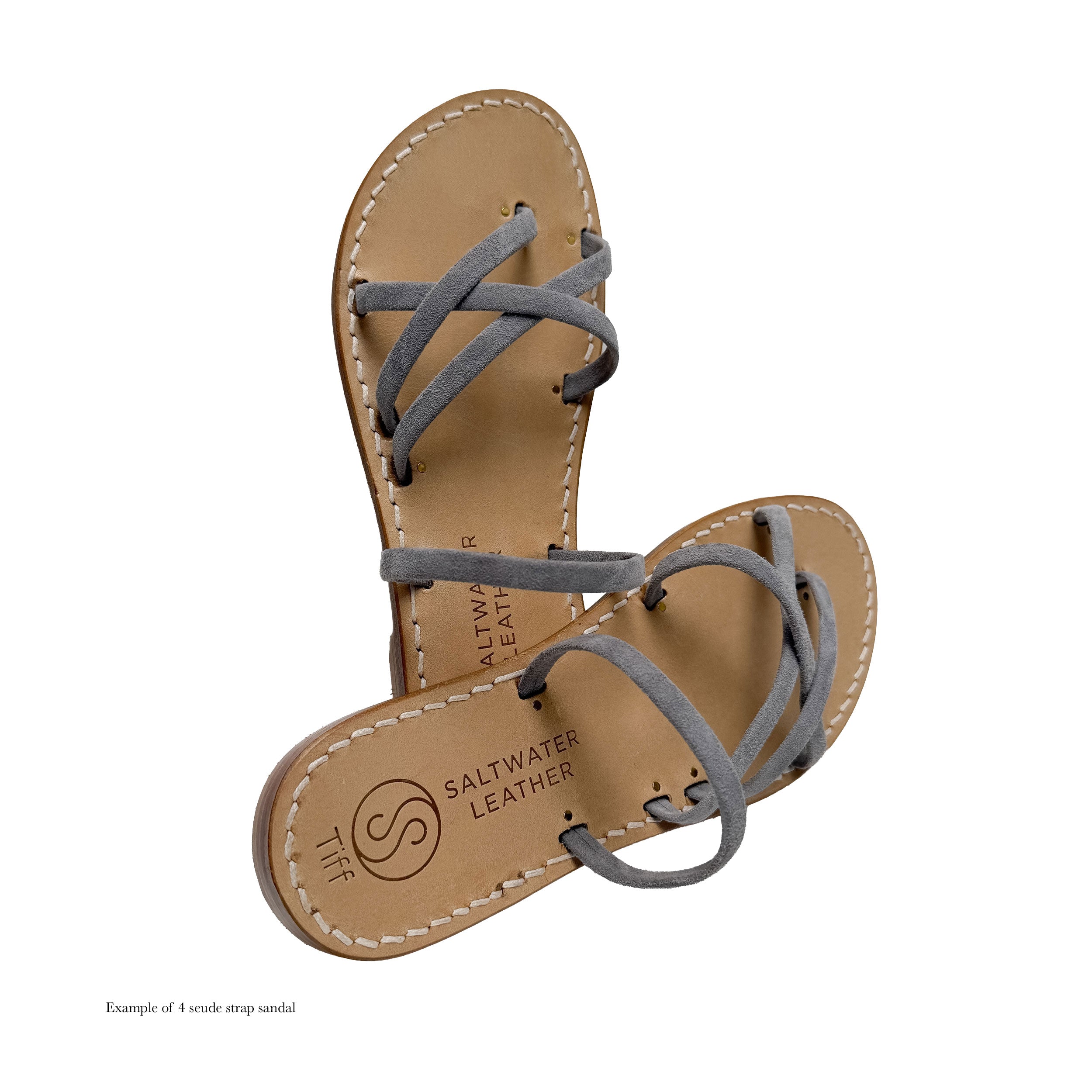 Pair of sandals with gray straps on a white background, featuring Saltwater Leather branding.