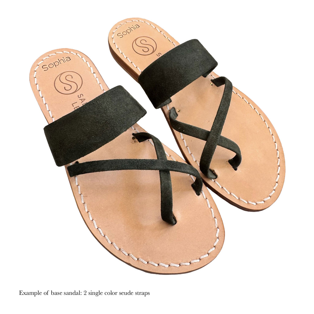 Pair of sandals with green straps on a white background