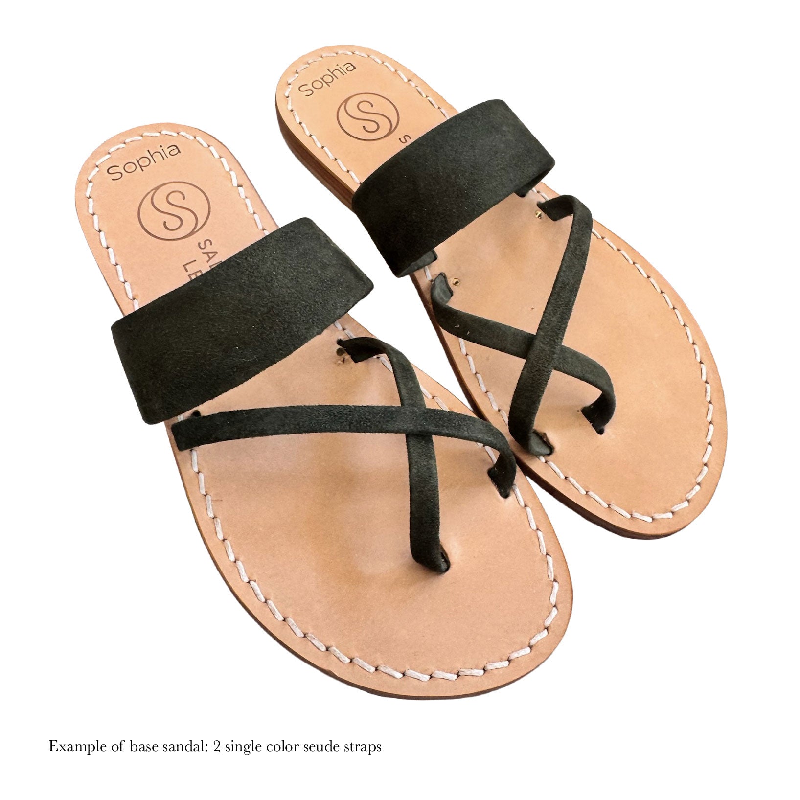 Pair of sandals with green straps on a white background