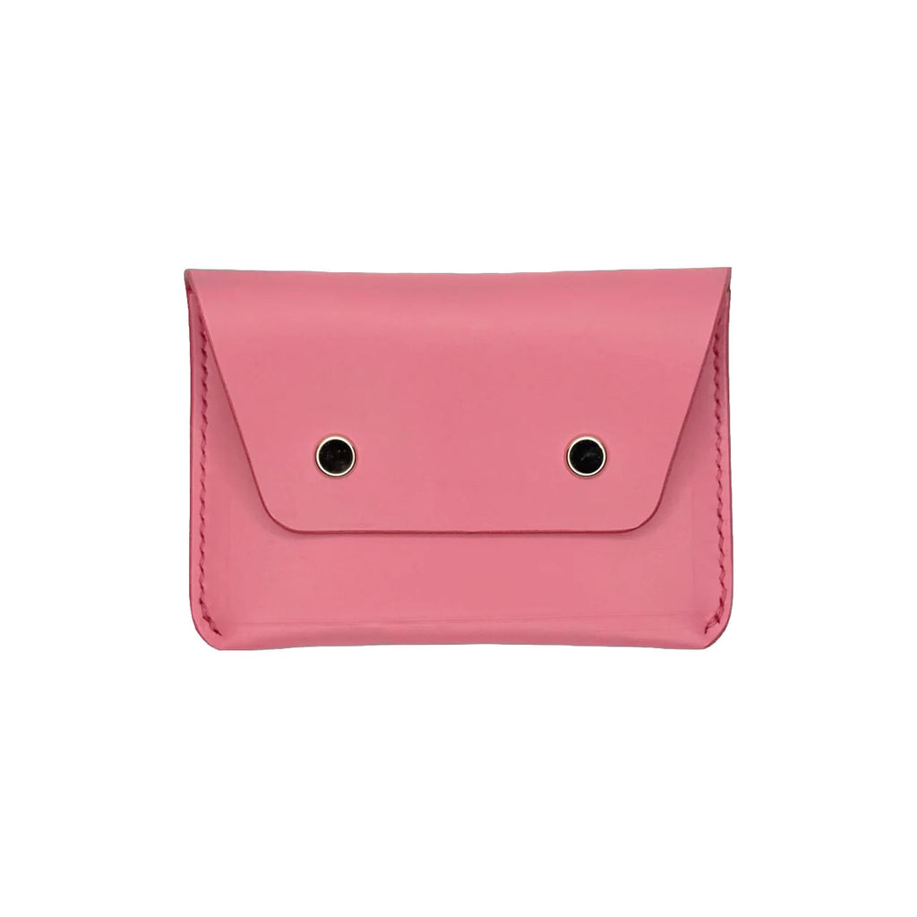 Pink wallet with black accents on a white background