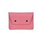 Pink wallet with black accents on a white background