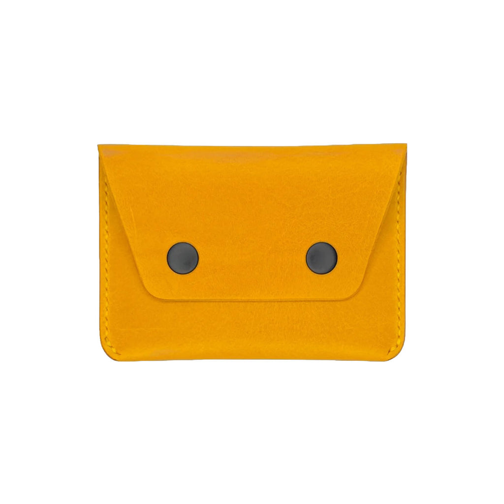 Yellow wallet with two black buttons on a white background