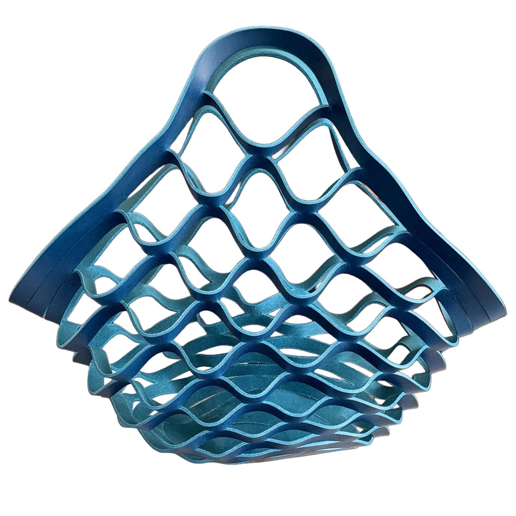 Blue leather woven basket on a white background