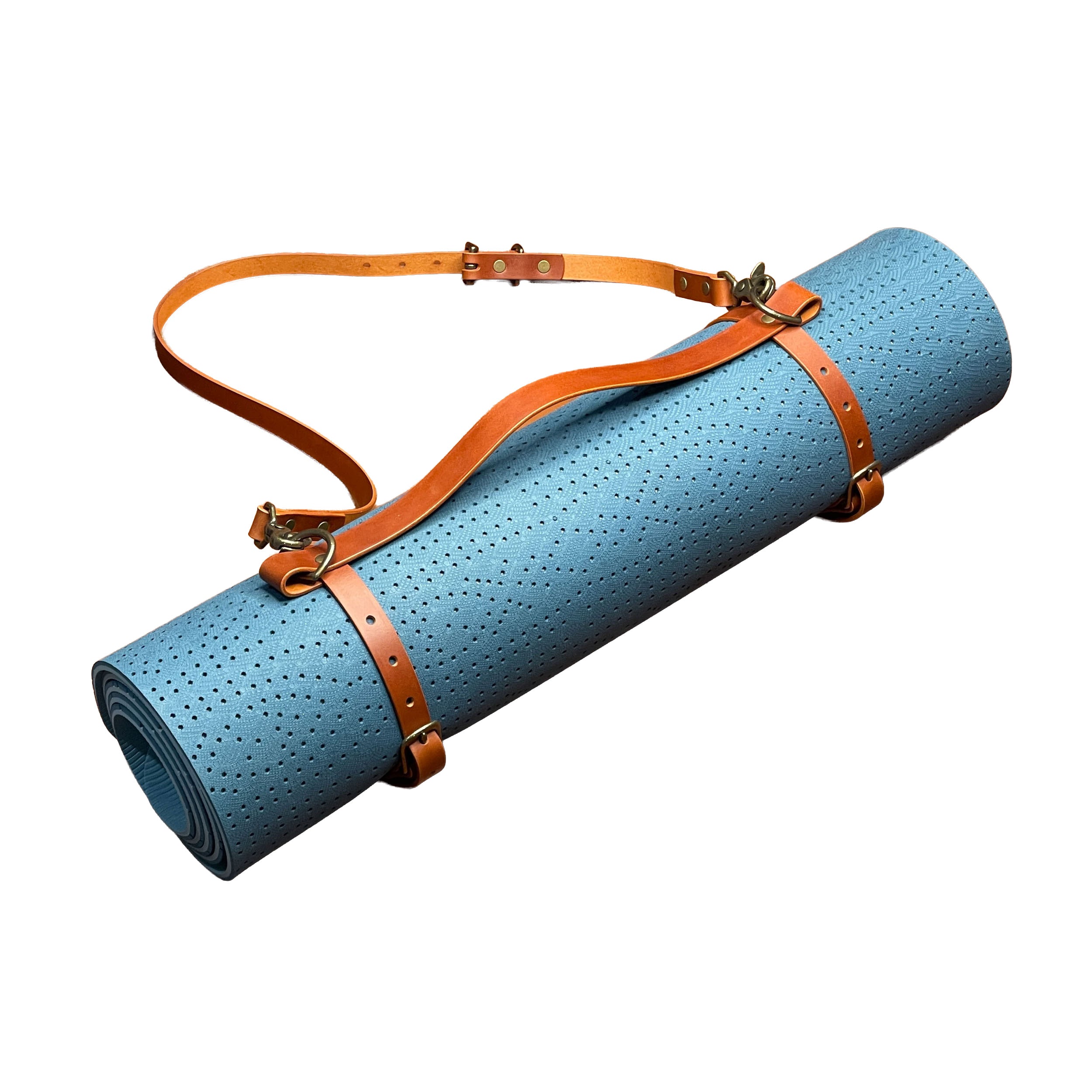 Blue yoga mat with a brown leather strap on a white background
