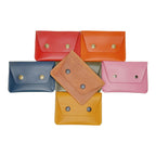 Set of colorful leather wallets on a white background