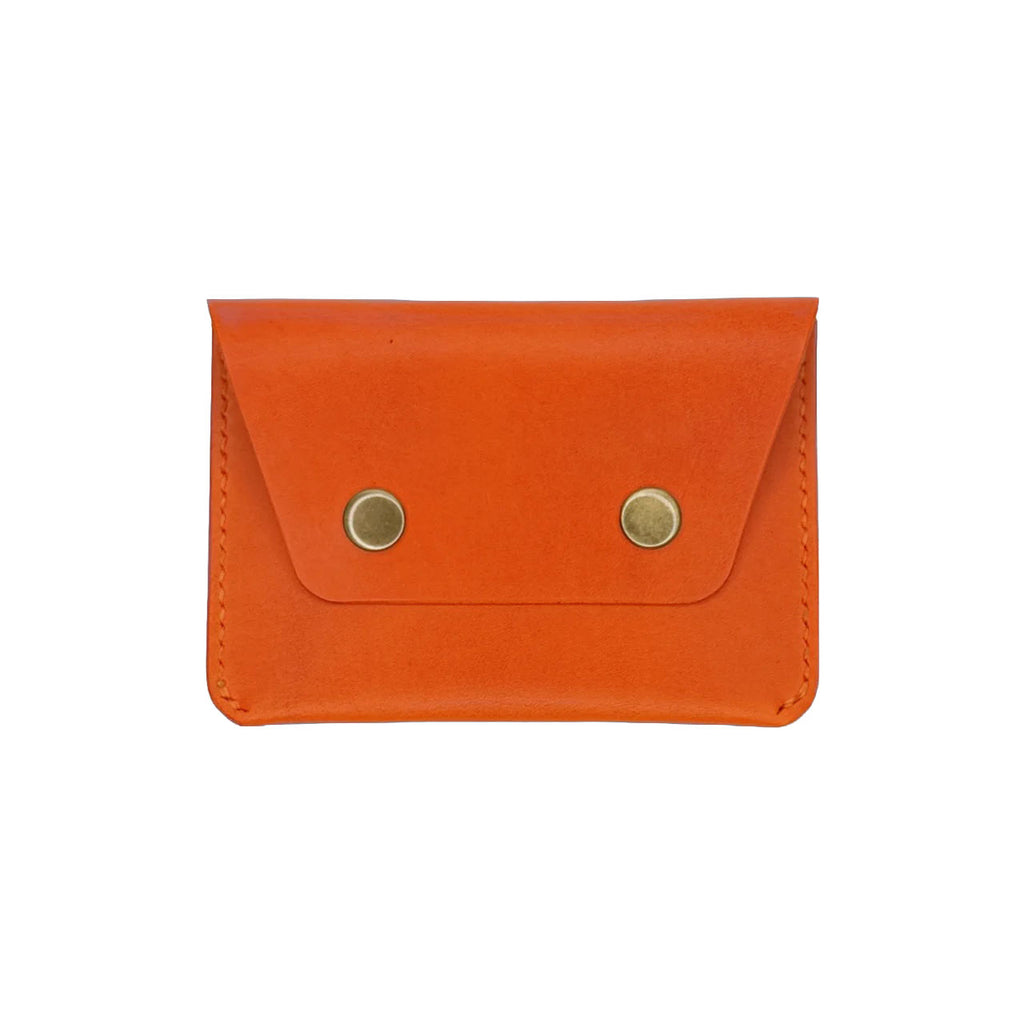 Orange leather wallet with gold buttons on a white background