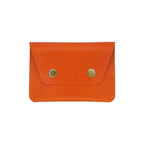 Orange leather wallet with gold buttons on a white background